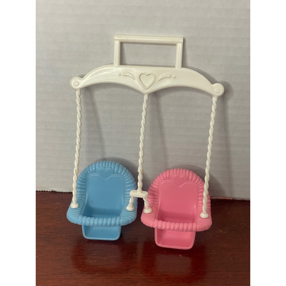 Fisher-Price Loving Family twin baby swing, featuring pink and blue seat 1993